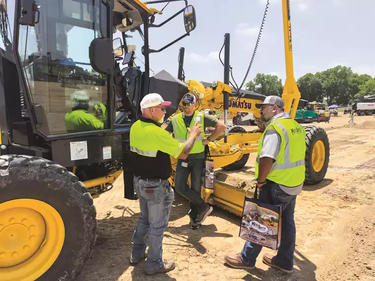 KSM personnel answer questions related to equipment and technology.